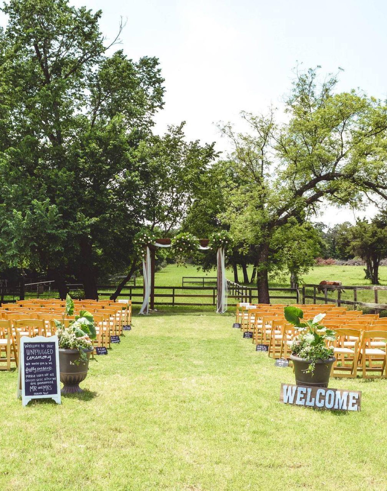 A wedding ceremony set on the lawn at Circle R Ranch